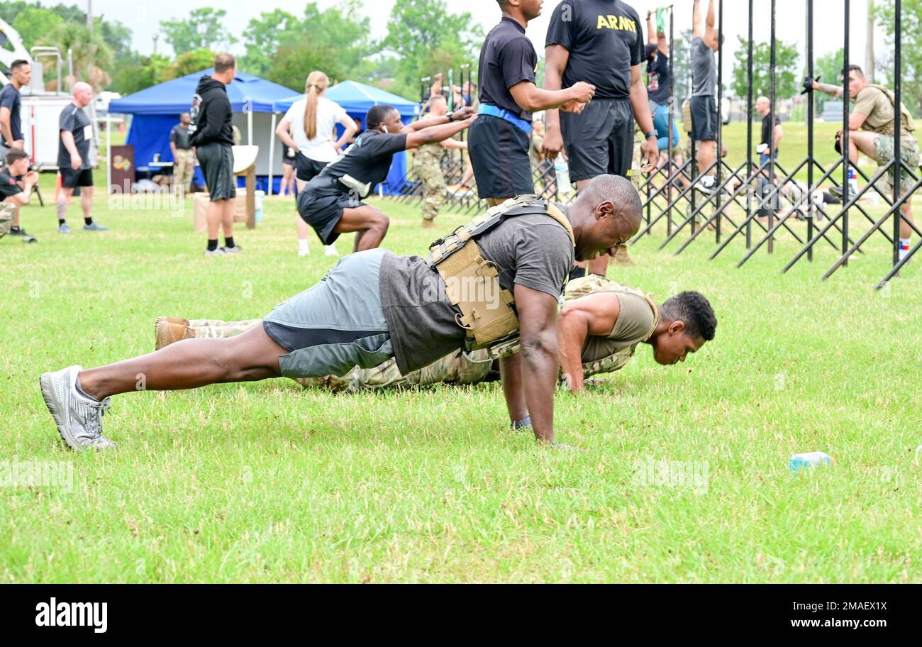 Staff Sgt. Ibrahima S. Bangoura, a drill sergeant assigned to 2nd Battalion, 39th Infantry Regiment, works to complete 200 push-ups during the Murph Challenge held at Patton Stadium May 26, 2022. The 165th Infantry Brigade hosted the challenge and arranged for Special Operator 1st Class Marcus Luttrell, a member of the four-man SEAL Delivery Team 1 that was critically wounded during Operation Red Wings, Afghanistan. Luttrell gave the opening remarks before the start of the challenge consisting of a 1-mile run, 100 pull-ups, 200 push-ups, 300 squats and a final one-mile run. Stock Photo