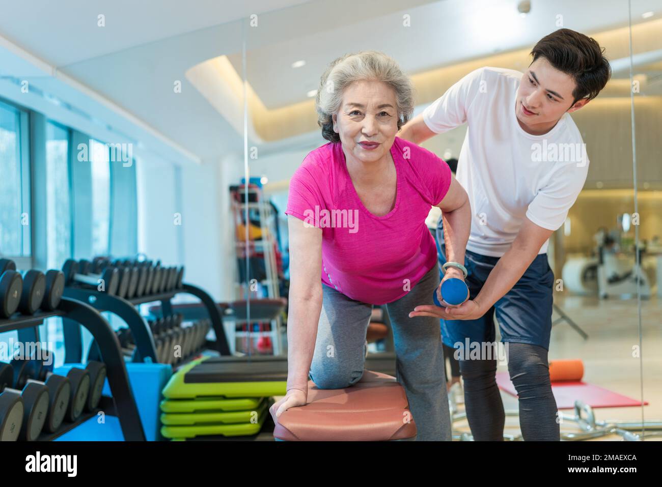 Elderly woman kneeling hi-res stock photography and images - Alamy