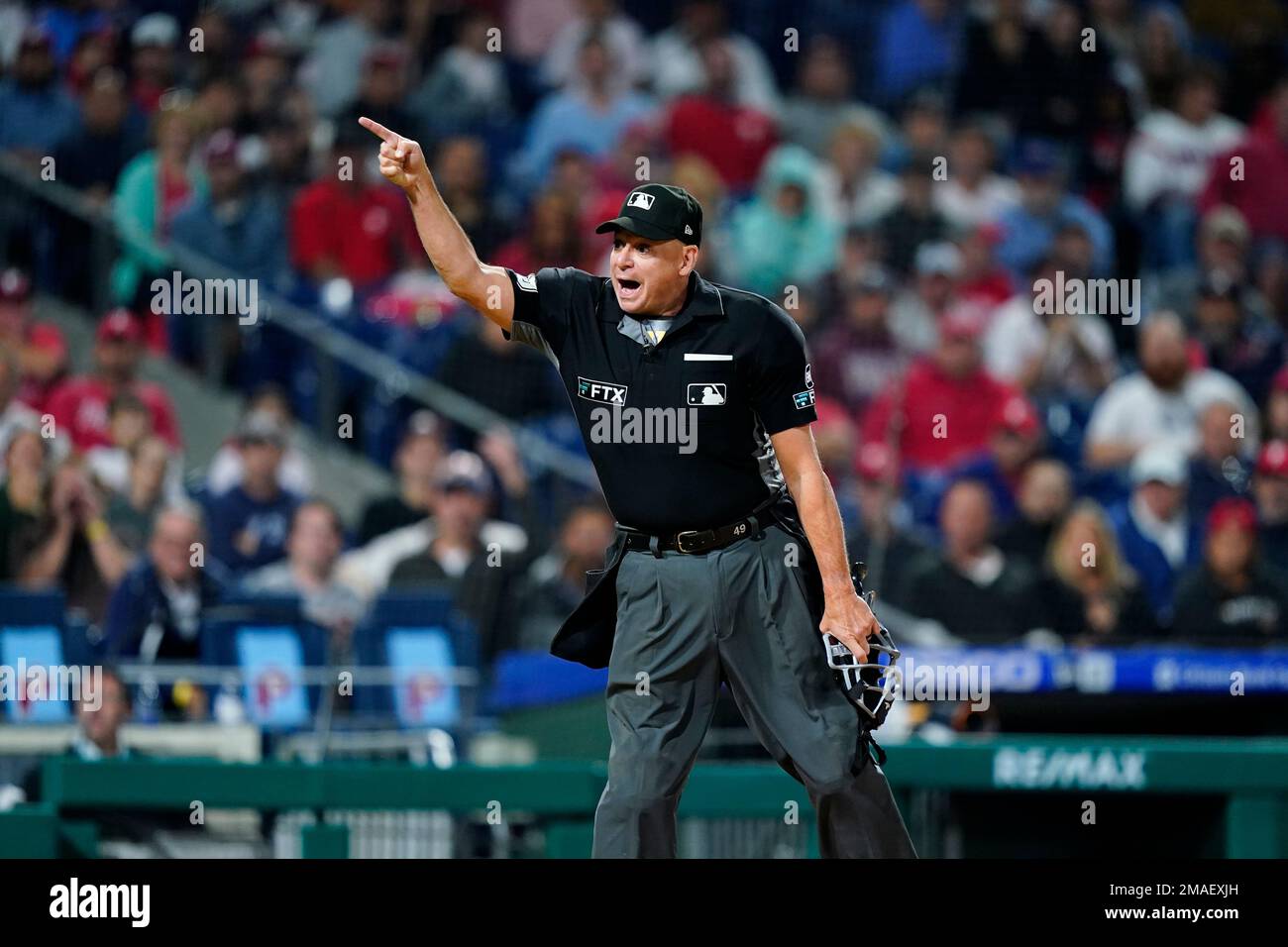 Home plate umpire Andy Fletcher ejects a Philadelphia Phillies coach