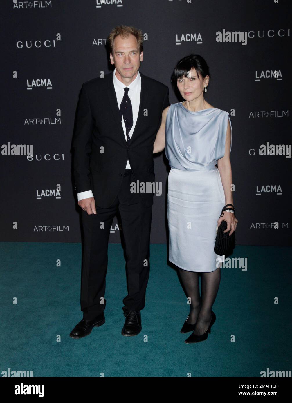 Actor Julian Sands (L) and his wife, Evgenia Citkowitz arrive at the LACMA 2015 Art+Film Gala at LACMA on November 7, 2015 in Los Angeles, California. Photo by Francis Specker Stock Photo