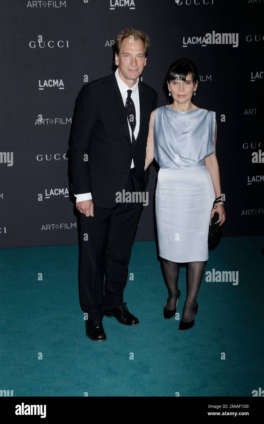 Actor Julian Sands (L) and his wife, Evgenia Citkowitz arrive at the LACMA 2015 Art+Film Gala at LACMA on November 7, 2015 in Los Angeles, California. Photo by Francis Specker Stock Photo