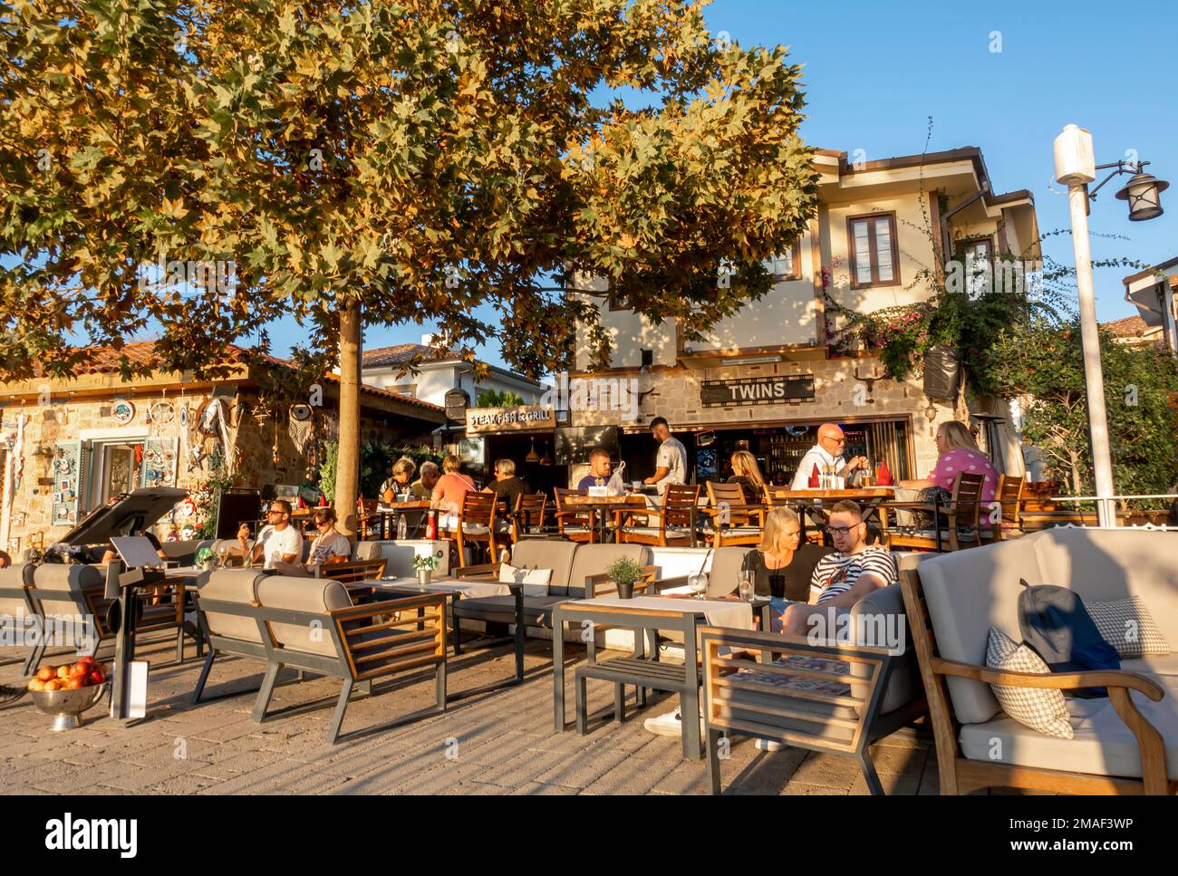 Antalya tourism. Tourists at the outdoor cafe in a resort town Side, Antalya, Turkey Stock Photo