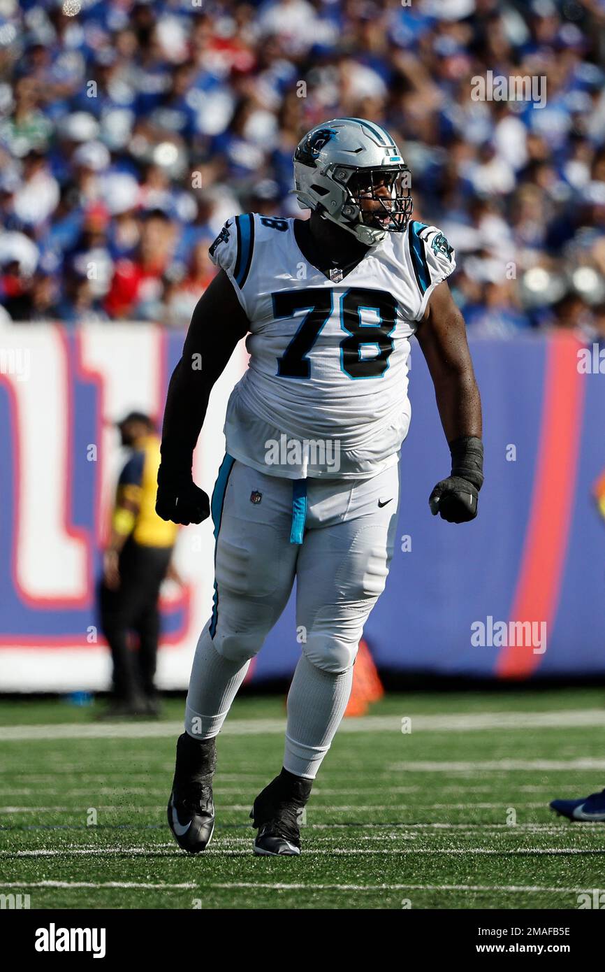 Carolina Panthers defensive tackle Marquan McCall (left) exchanges jerseys  with Denver Broncos defensive end Matt Henningsen (right) following an NFL  football game, Sunday, Nov. 27, 2022, in Charlotte, N.C. (AP Photo/Brian  Westerholt