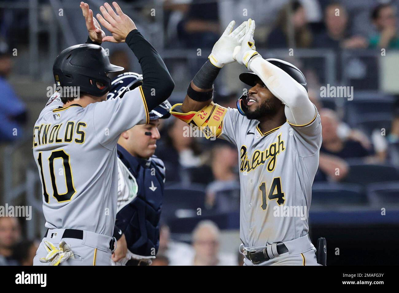 Pittsburgh Pirates' Rodolfo Castro celebrates with Bryan Reynolds (10) as  New York Yankees catcher Jose Trevino looks down after Castro hits a home  run against New York Yankees relief pitcher Clay Holmes