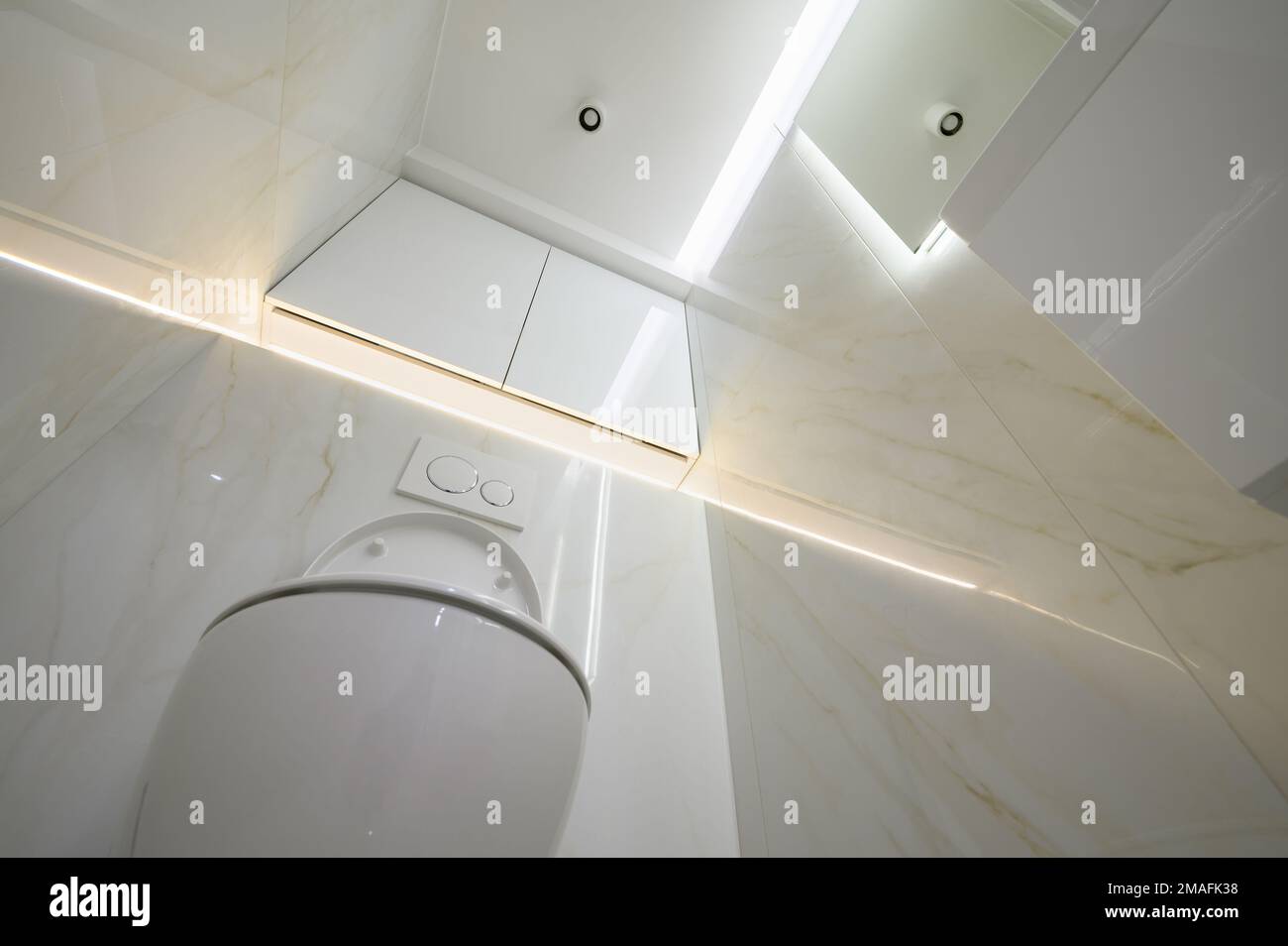 New ceramic toilet bowl in a white toilet room Stock Photo - Alamy