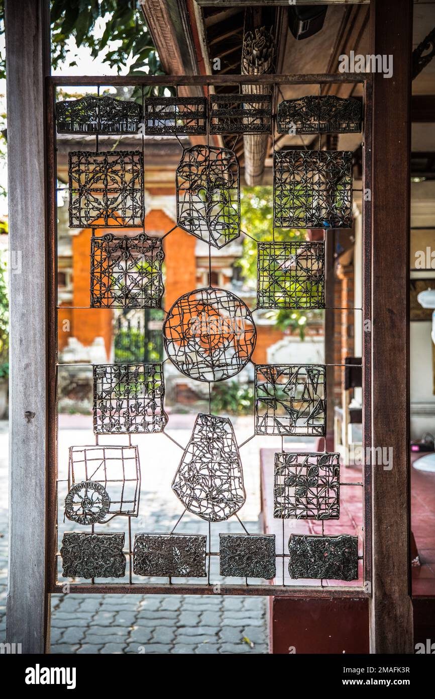 Various metal pattern molds for making traditional batik designs Bali Indonesia Stock Photo