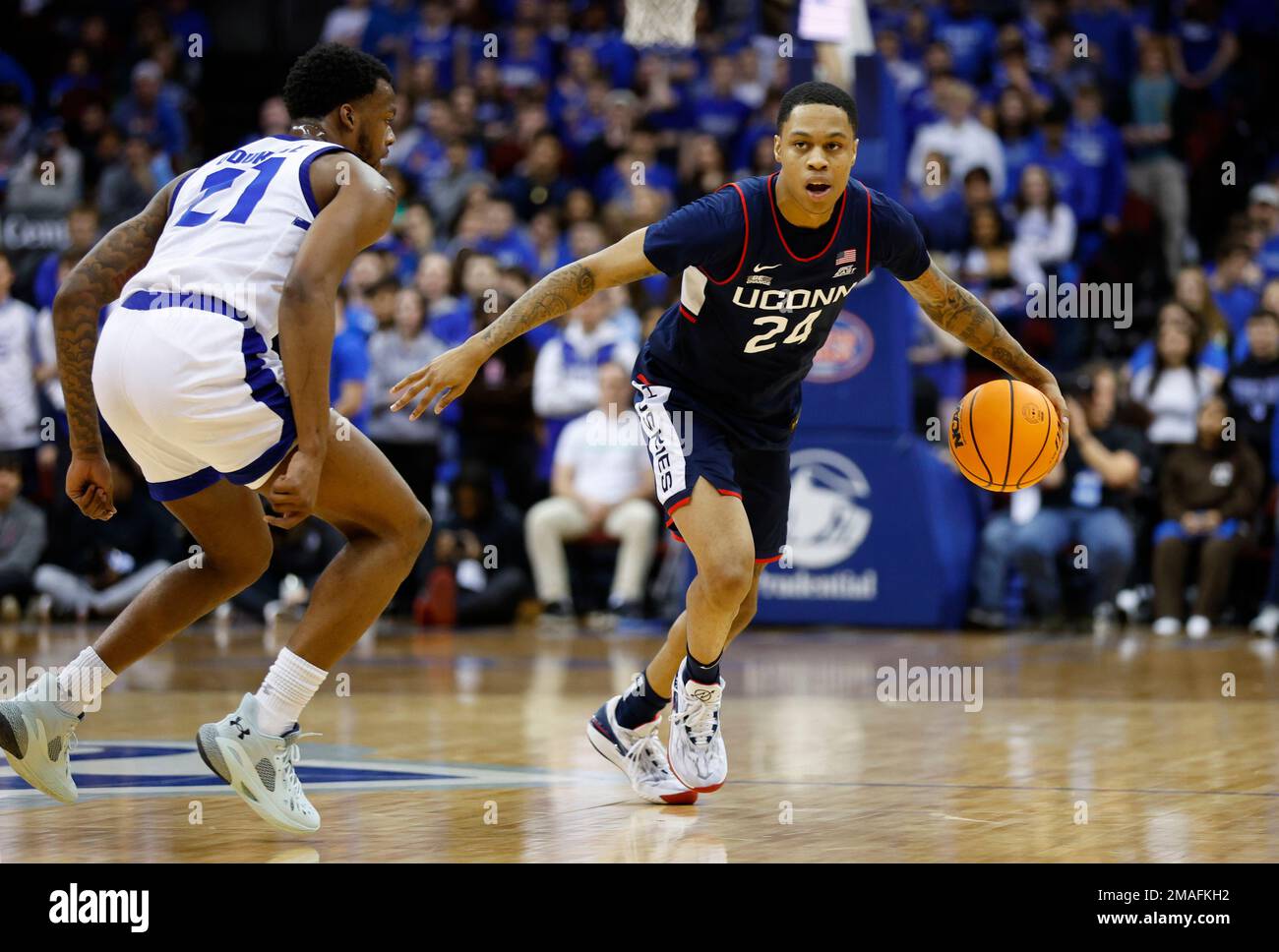 UConn guard Jordan Hawkins (24) drives to the basket against Seton Hall