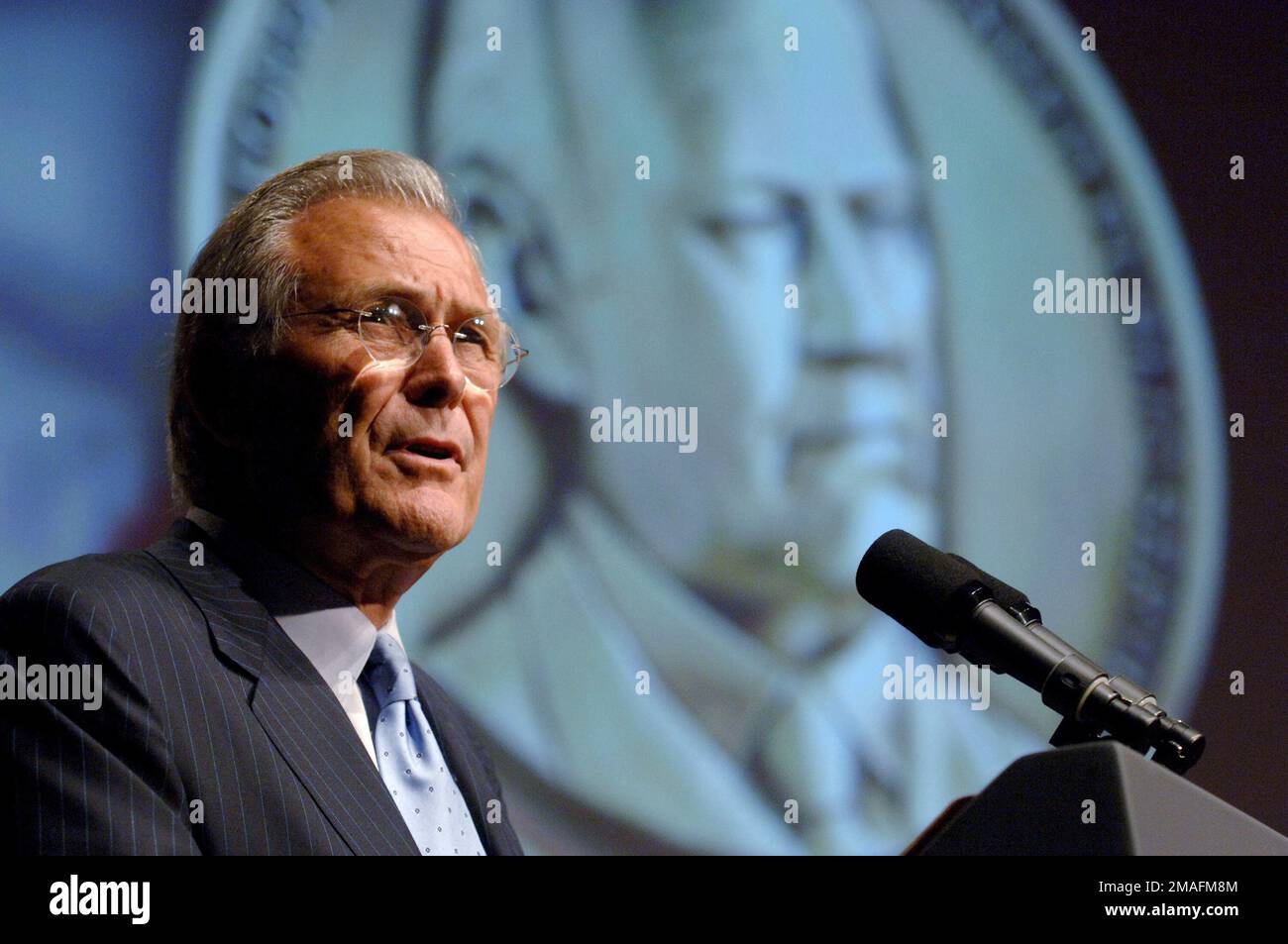 060619-N-0696M-396. [Complete] Scene Caption: The Honorable Donald H. Rumsfeld, U.S. Secretary of Defense, speaks during the presentation ceremony of the Gerald R. Ford medal for Distinguished Public Service held at the National Archives in Washington, District of Columbia, on June 19, 2006. This award is presented to five U.S. military service members, each representing their respective service, in recognition for their outstanding public contributions that reflect the qualities demonstrated by President Ford during his public service career. These qualities are: strength of character, integr Stock Photo