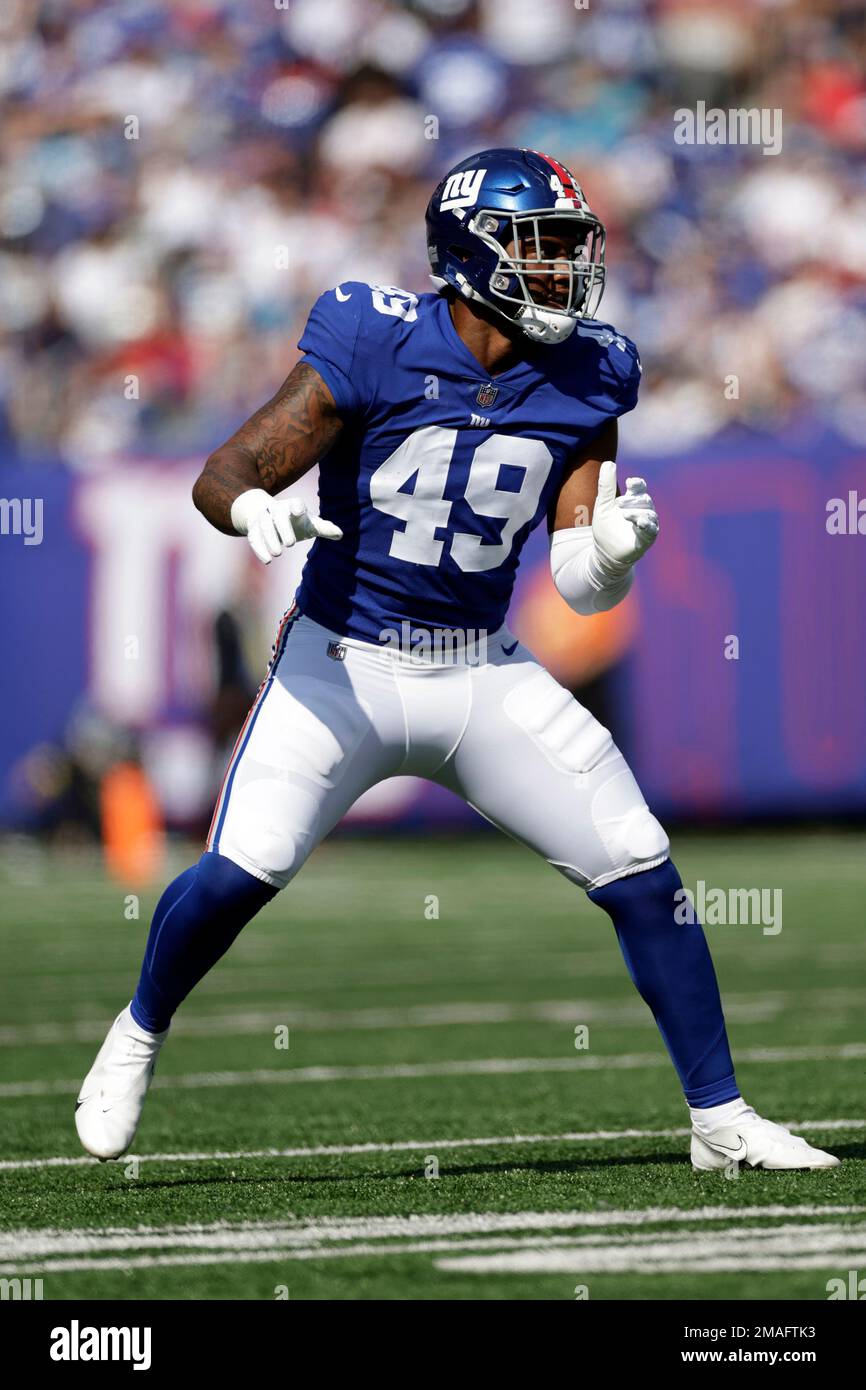 New York Giants linebacker Tomon Fox (49) walks off the field after an NFL  football game against the Houston Texans on Sunday, Nov. 13, 2022, in East  Rutherford, N.J. (AP Photo/Adam Hunger