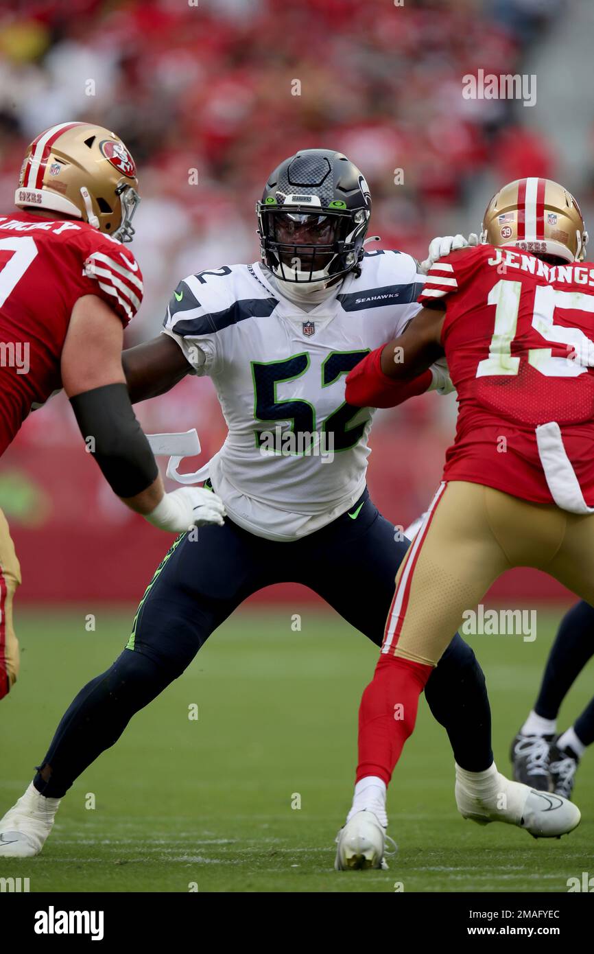 Seattle Seahawks defensive end Darrell Taylor (52) looks into the backfield  during an NFL football game against the San Francisco 49ers, Sunday, Sept.  18, 2022, in Santa Clara, Calif. (AP Photo/Scot Tucker