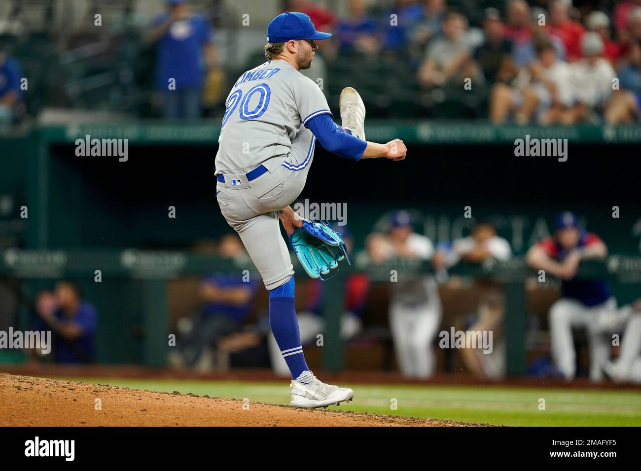 Toronto Blue Jays' Adam Cimber follows through on his delivery to