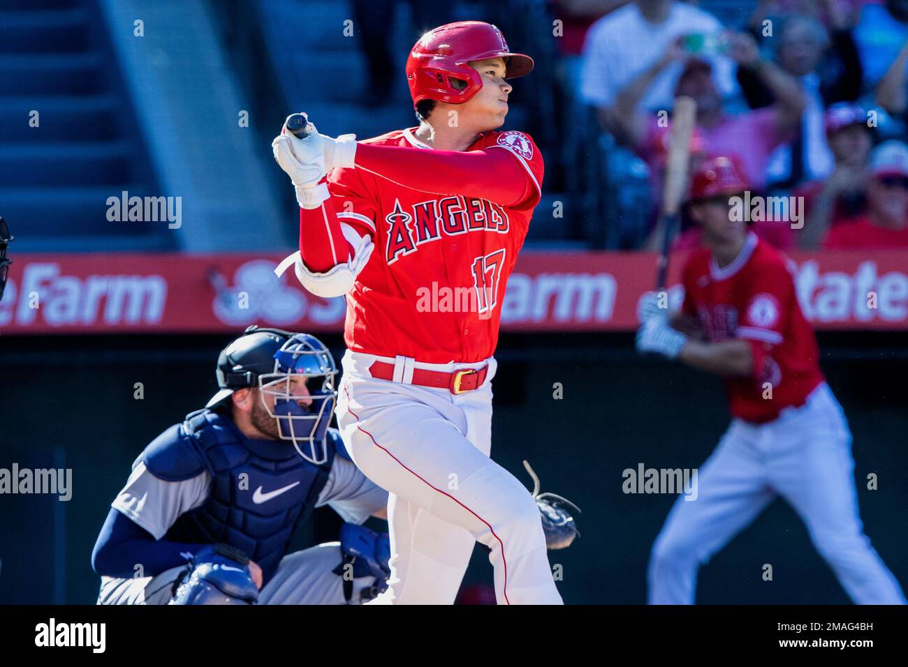 Los Angeles Angels designated hitter Shohei Ohtani, right, follows