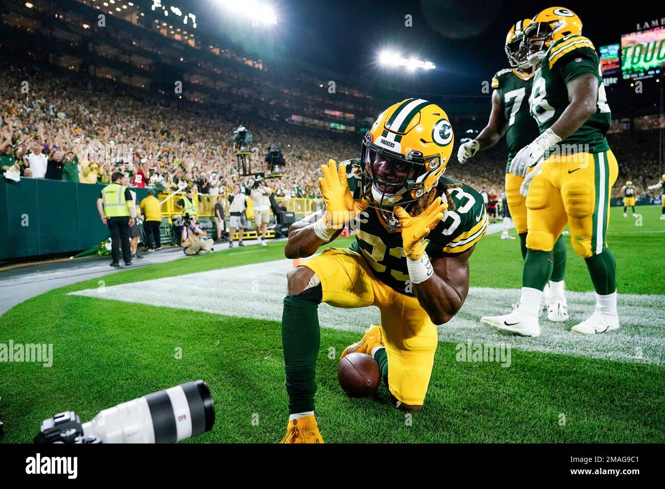 Green Bay Packers' Aaron Jones celebrates his touchdown run during