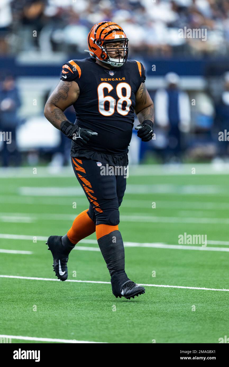 Cincinnati Bengals defensive end Josh Tupou (68) runs off the