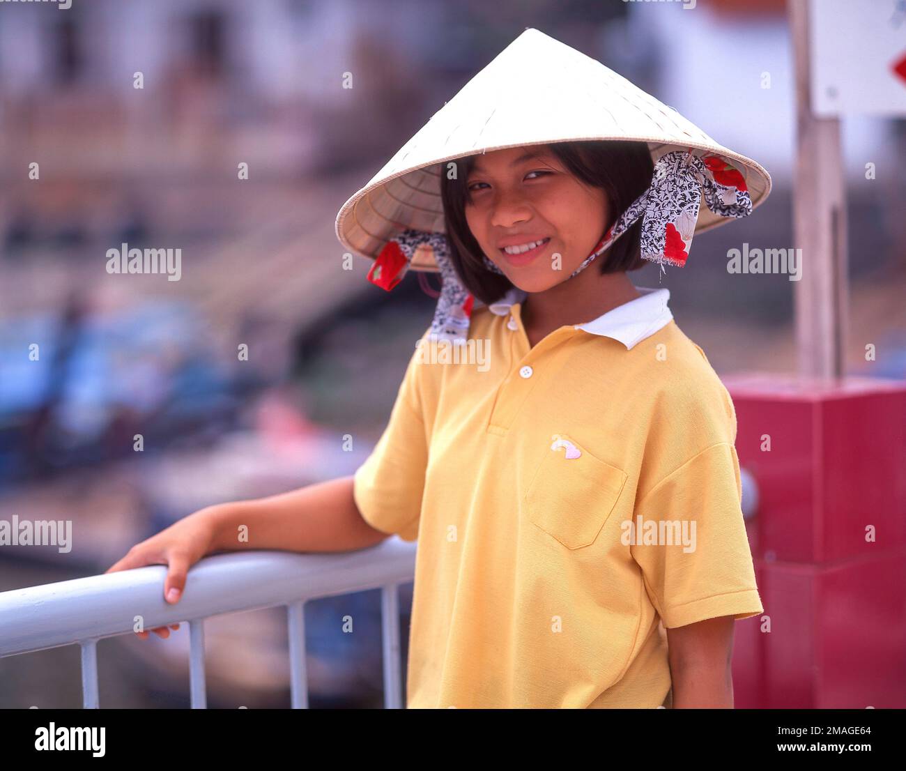 Young Vietnamese girl wearing Nón lá conical hat, Cholon, Ho Chi Minh City (Saigon), Socialist Republic of Vietnam Stock Photo