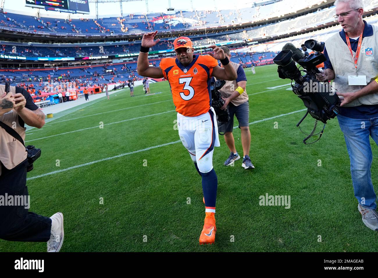 Denver Broncos quarterback Russell Wilson (3) leaves the field after an ...