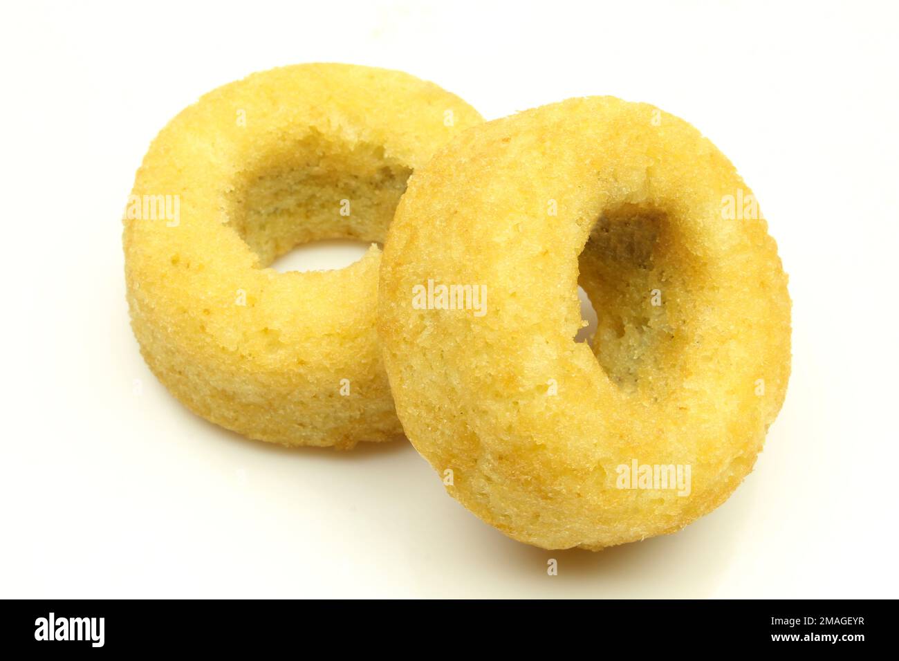 Two ring shaped spongy sweet desserts isolated on white background Stock Photo Alamy