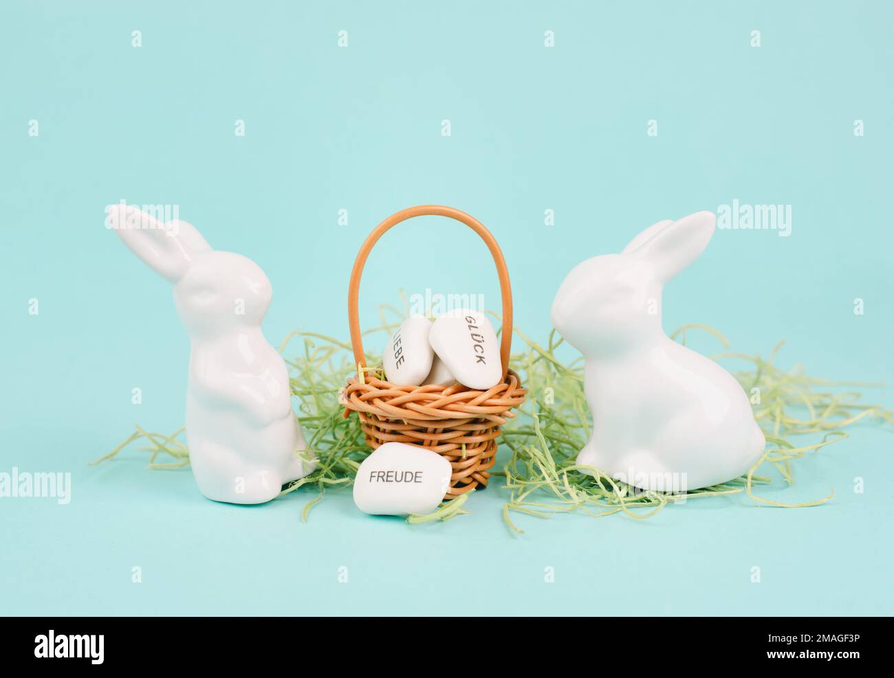 Wicker basket and easter bunny, words like love, luck and joy are