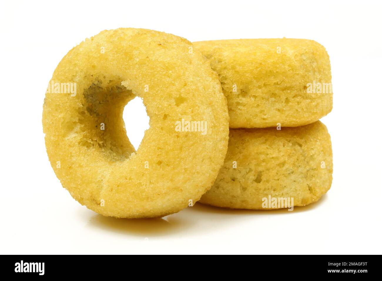 Three ring shaped spongy sweet desserts isolated on white background Stock Photo Alamy