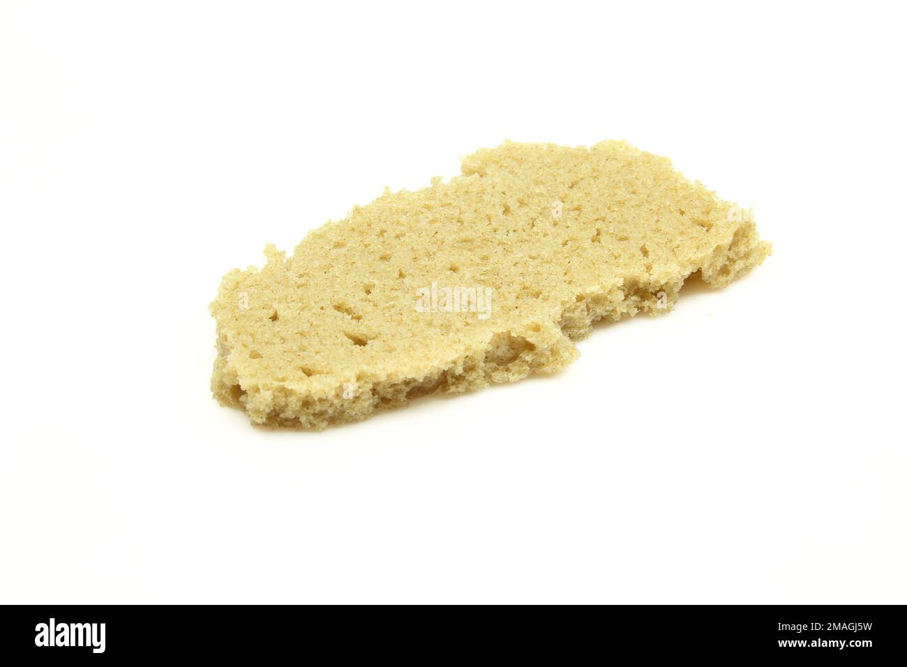 Piece of rye bread isolated on white background.Bite size fragment