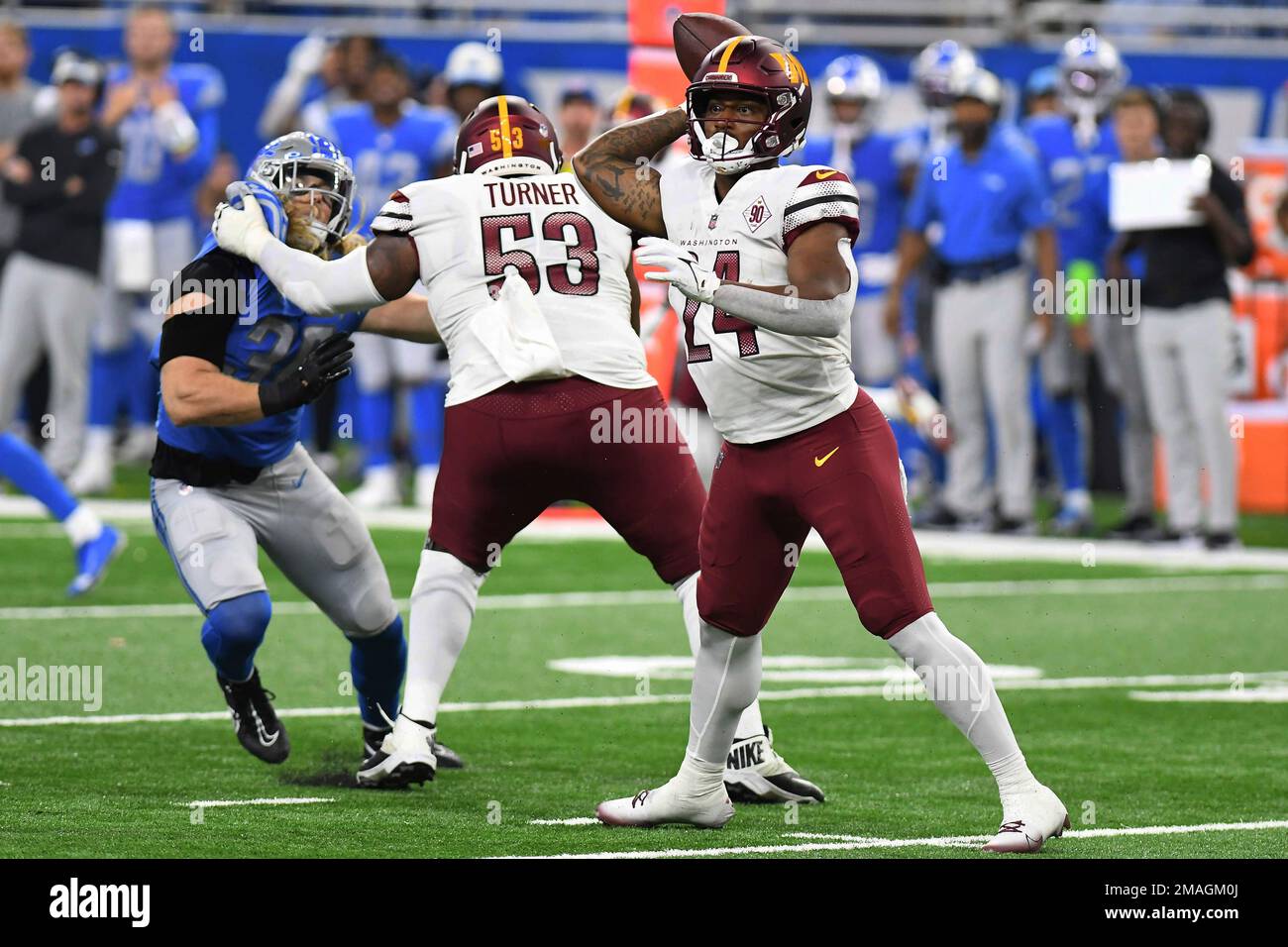 Washington Commanders running back Antonio Gibson (24) throws a pass