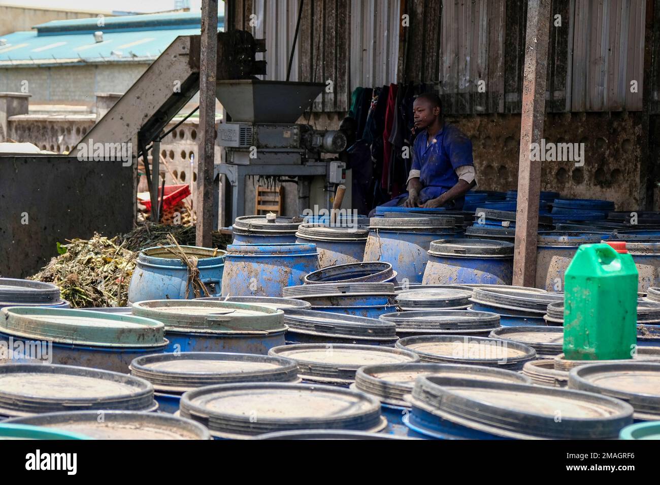 A worker stands next to the waste collection area at Marula Proteen Ltd, who produce organic