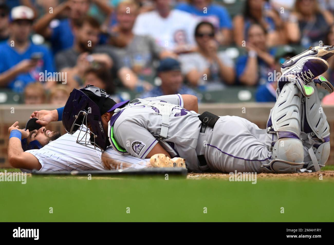 Chicago Cubs' Alfonso Rivas, left, is tagged out at home plate by ...
