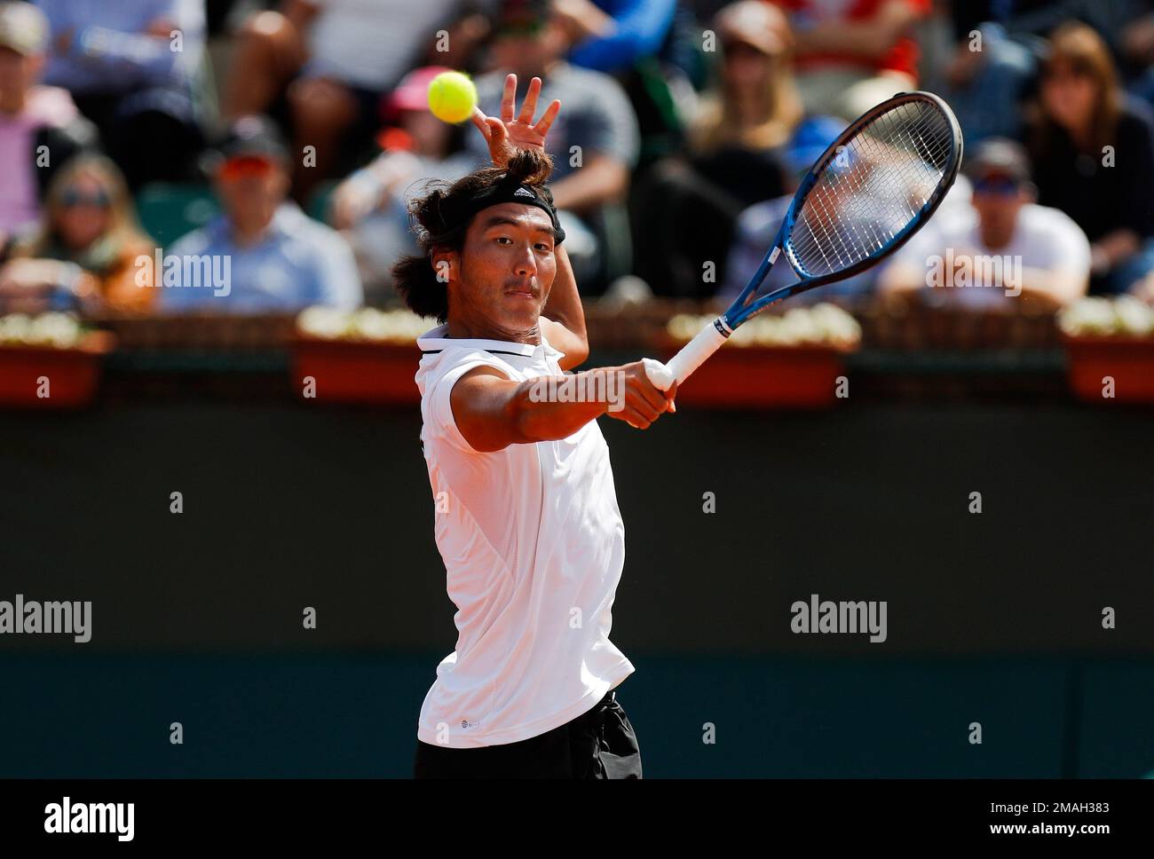 Chinas Bu Yunchaokete returns the ball to Uruguays Martin Cuevas and Ignacio Carou during a Davis Cup World Group II doubles tennis match in Montevideo, Uruguay, Saturday, Sept