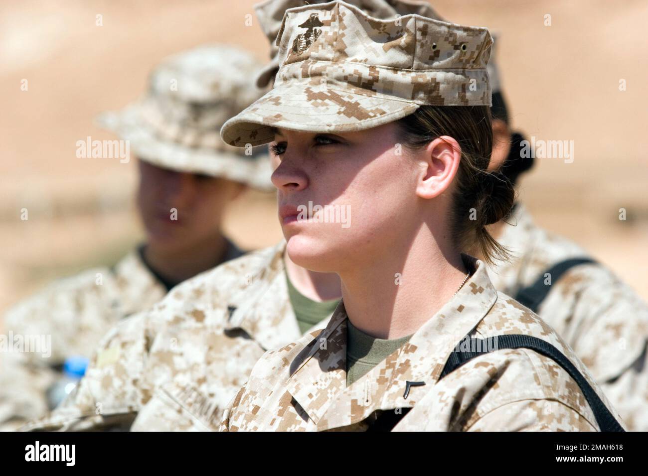 070327-M-9876R-016. [Complete] Scene Caption: PFC. Brittney Cummins (foreground), Marine Wing Headquarters Squadron 2, 2nd Marine Air Wing, receives training aboard Asad, Iraq on various Improvised Explosive Devices being used to attack Coalition and Iraqi forces, while attending the Lioness Program. This program is being utilized to ensure proper care is taken while searching Female Iraqis. Regimental Combat Team 2 is deployed with II Marine Expeditionary Force in support of Operation Iraq Freedom in the Anbar Province of Iraq MNF-W to develop the Iraqi Security Forces, facilitate the develop Stock Photo