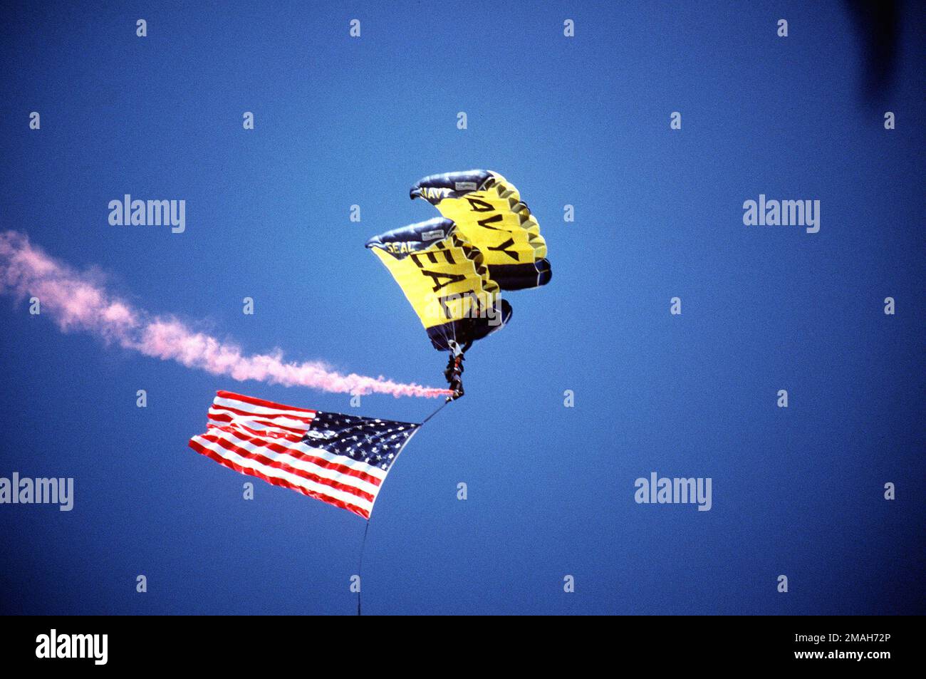 Two members of the U.S. Navy's parachute team, the Leap Frogs, open the