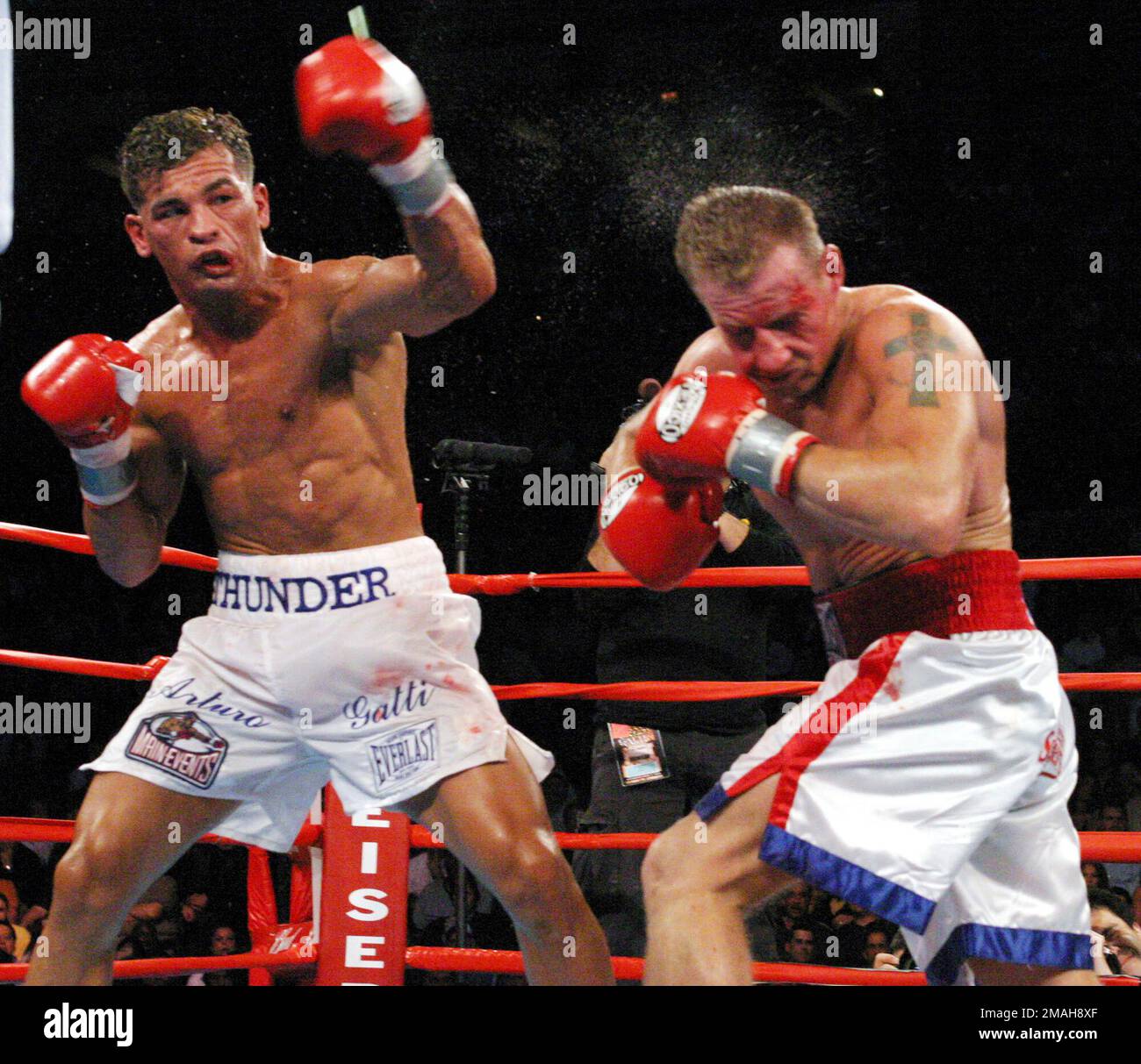 FILE - Arturo Gatti, left, punches Mickey Ward during the junior  welterweight fight in Atlantic City, N.J., on Saturday, June 7, 2003. The  fight lasted the the full 10 rounds and Gatti