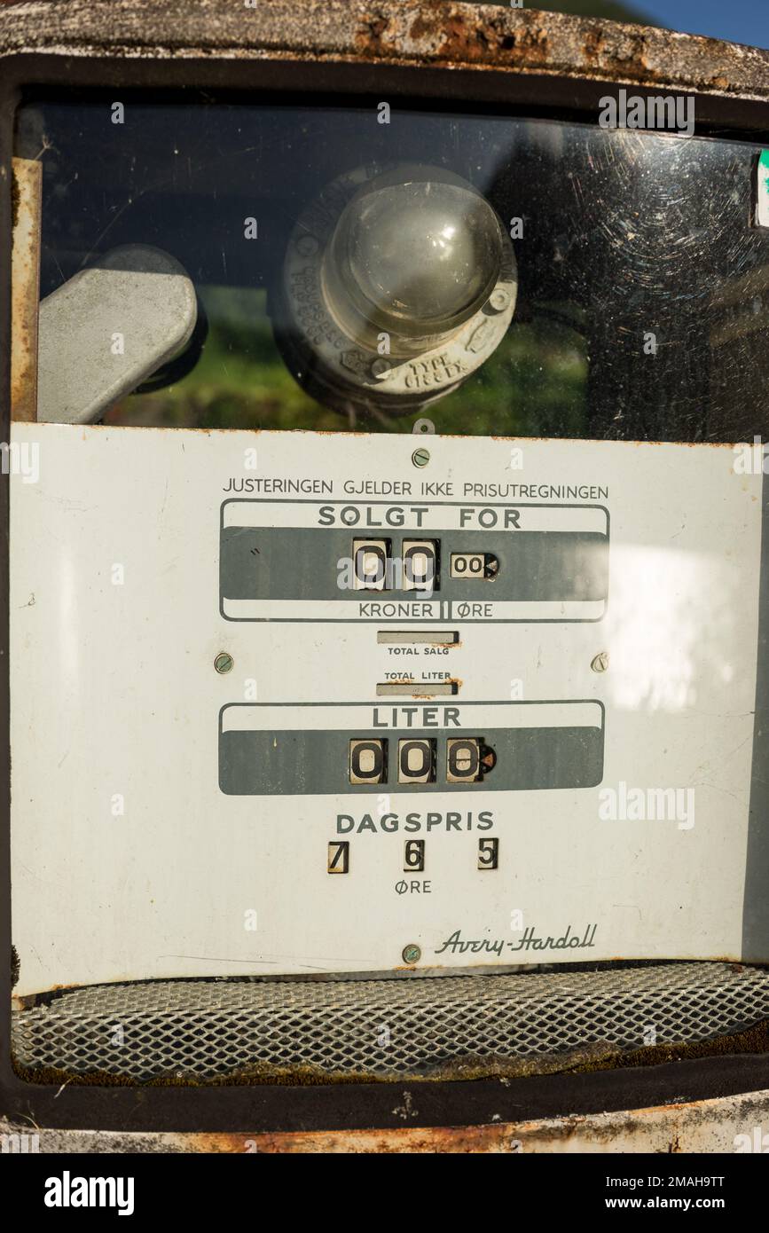 Old fuel pump in an abandoned gas station in Norway. It is possible to also see fuel price as it was the last time the gas station was in use. Stock Photo