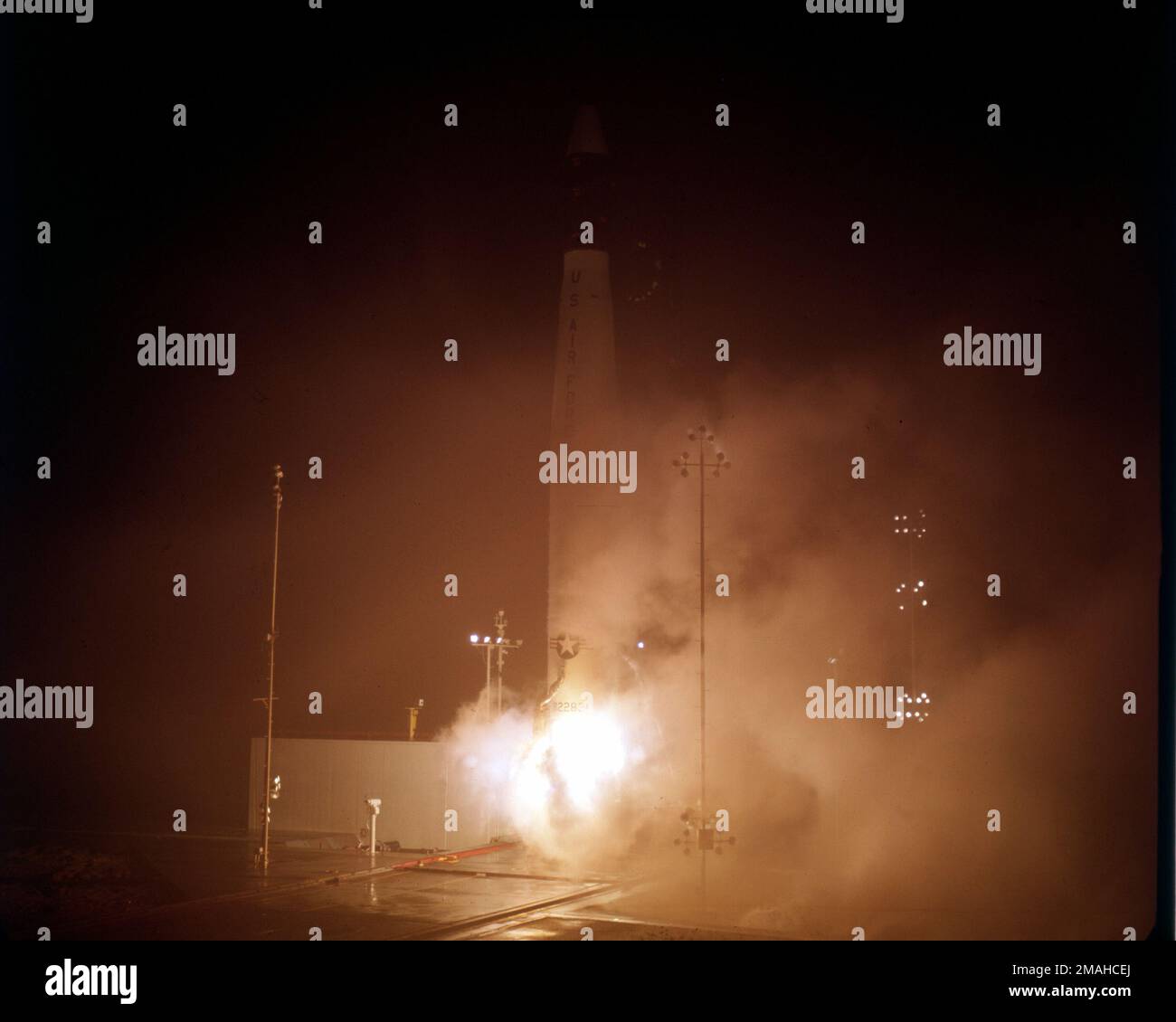 Night scene of a Thor missile, a standard launch vehicle, at ignition. Base: Los Angeles State: California (CA) Country: United States Of America (USA) Stock Photo