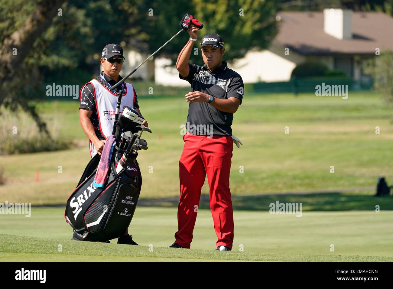 Hideki Matsuyama, of Japan, prepares to putt on the 17th green of the