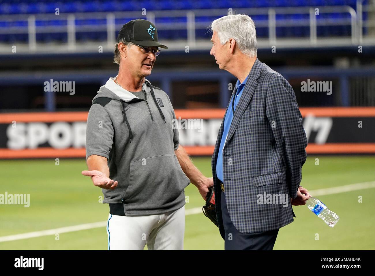 Miami Marlins manager Don Mattingly, left, talks with Miami