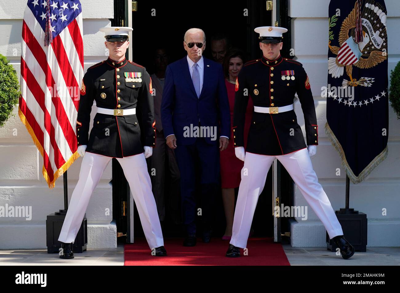 FILE President Joe Biden walks out to the South Lawn to sign into law
