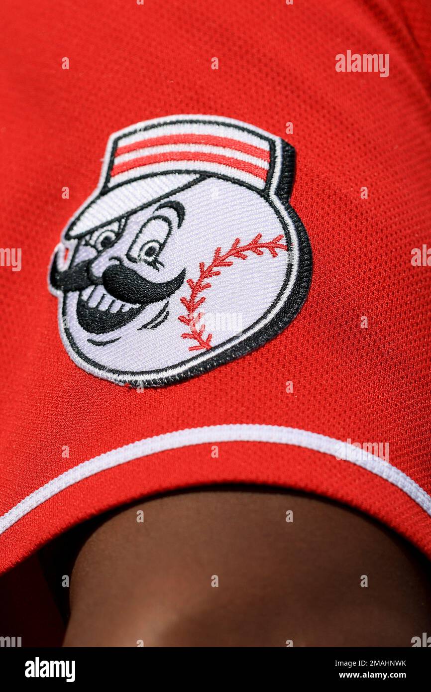 The Mr. Redlegs patch is seen soon the jersey of Cincinnati Reds' Chuckie  Robinson as he stands in the dugout during a baseball game against the  Pittsburgh Pirates in Cincinnati, Wednesday, Sept., image size:866x1390