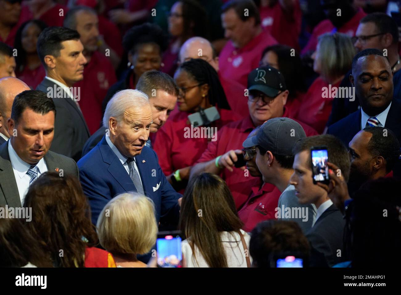 President Joe Biden greets people in the audience after speaking at the ...