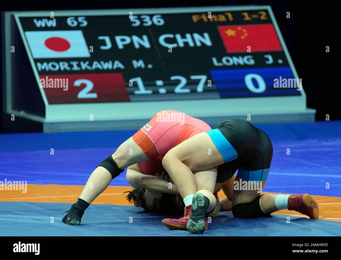 Japan's Miwa Morikawa, left, and China's Jia Long compete in their