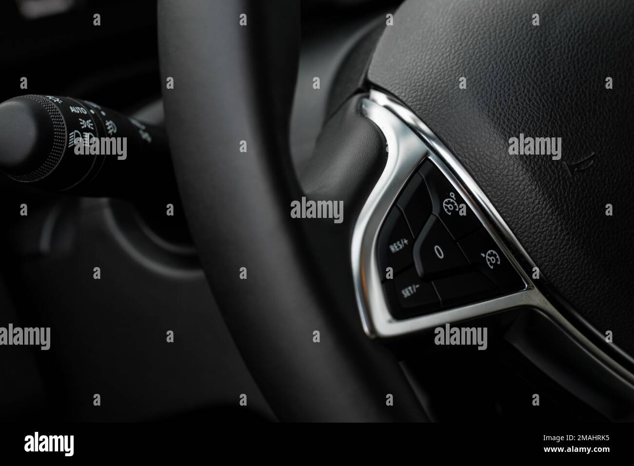 Cruise control switch closeup. Adaptive cruise control leaver. Cruise