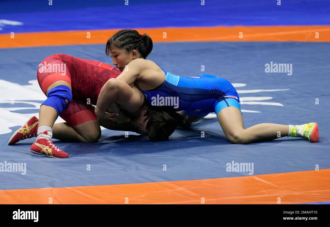 Japan's Yui Susaki, right, and Mongolia's Otgonjargal Dolgorjav compete ...