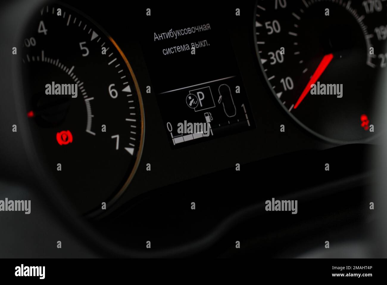 Fuel gauge close up. Car fuel dashboard details. Translation