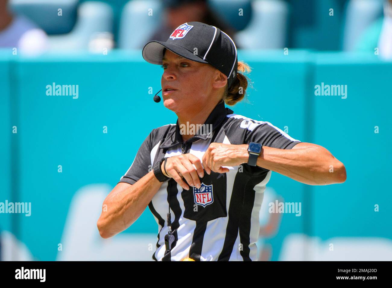 NFL down judge Robin DeLorenzo stands on the field during an NFL