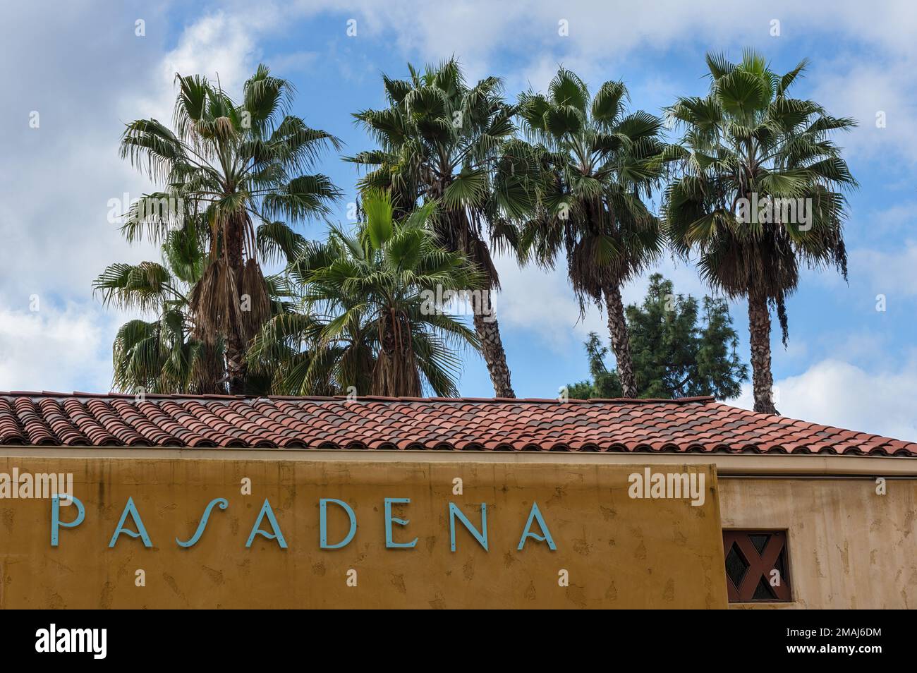 Pasadena, California, United States - January 16, 2023:  building exterior in the Del Mar Station Transit Village shown against palm trees and sky wit Stock Photo