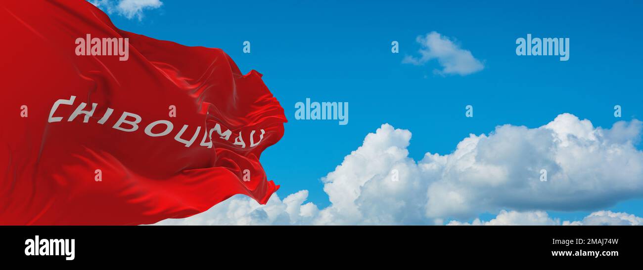 official flag of Chibougamau, Quebec Canada at cloudy sky background on