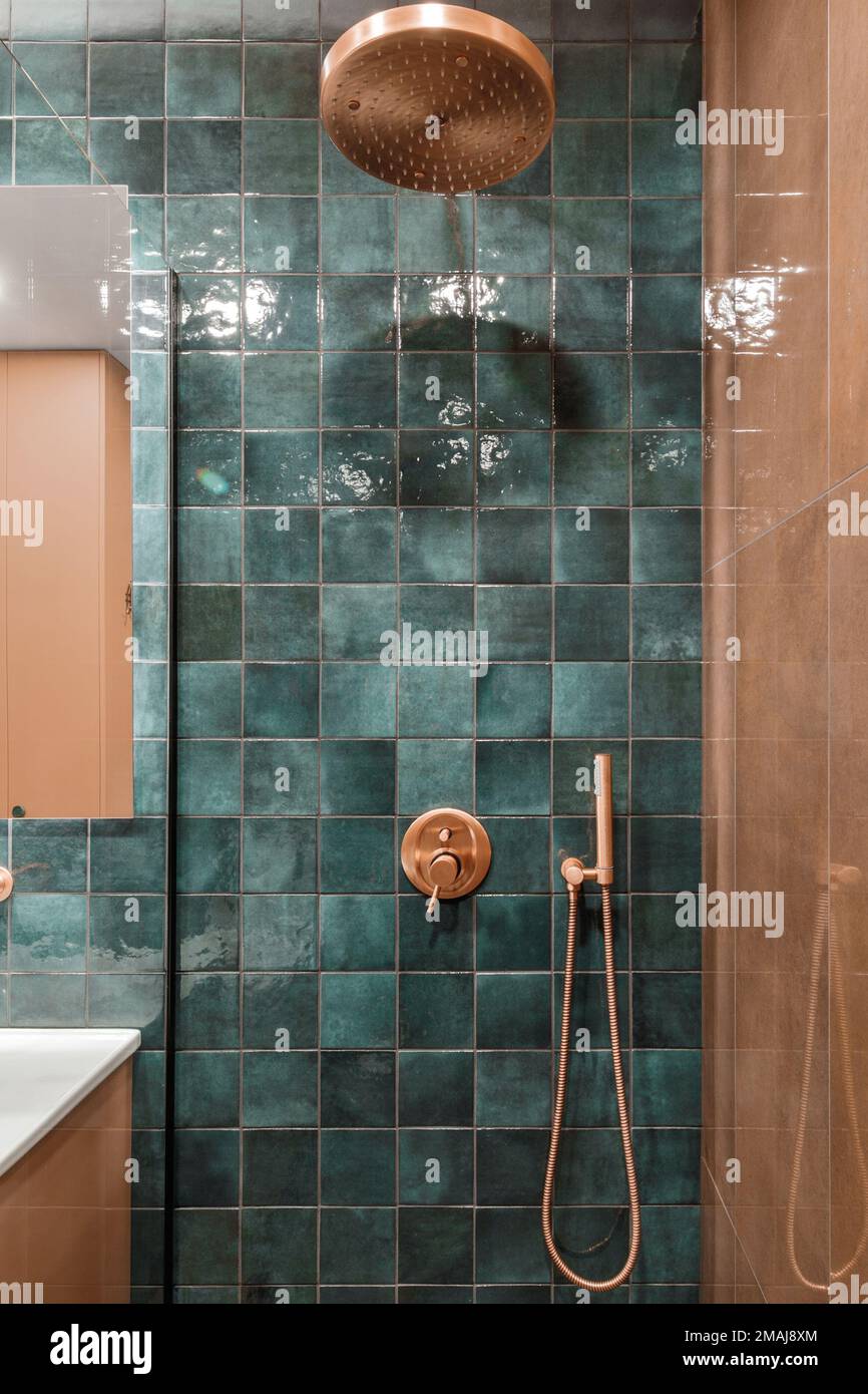 Minimalistic bathroom interior design in green and terracotta shades