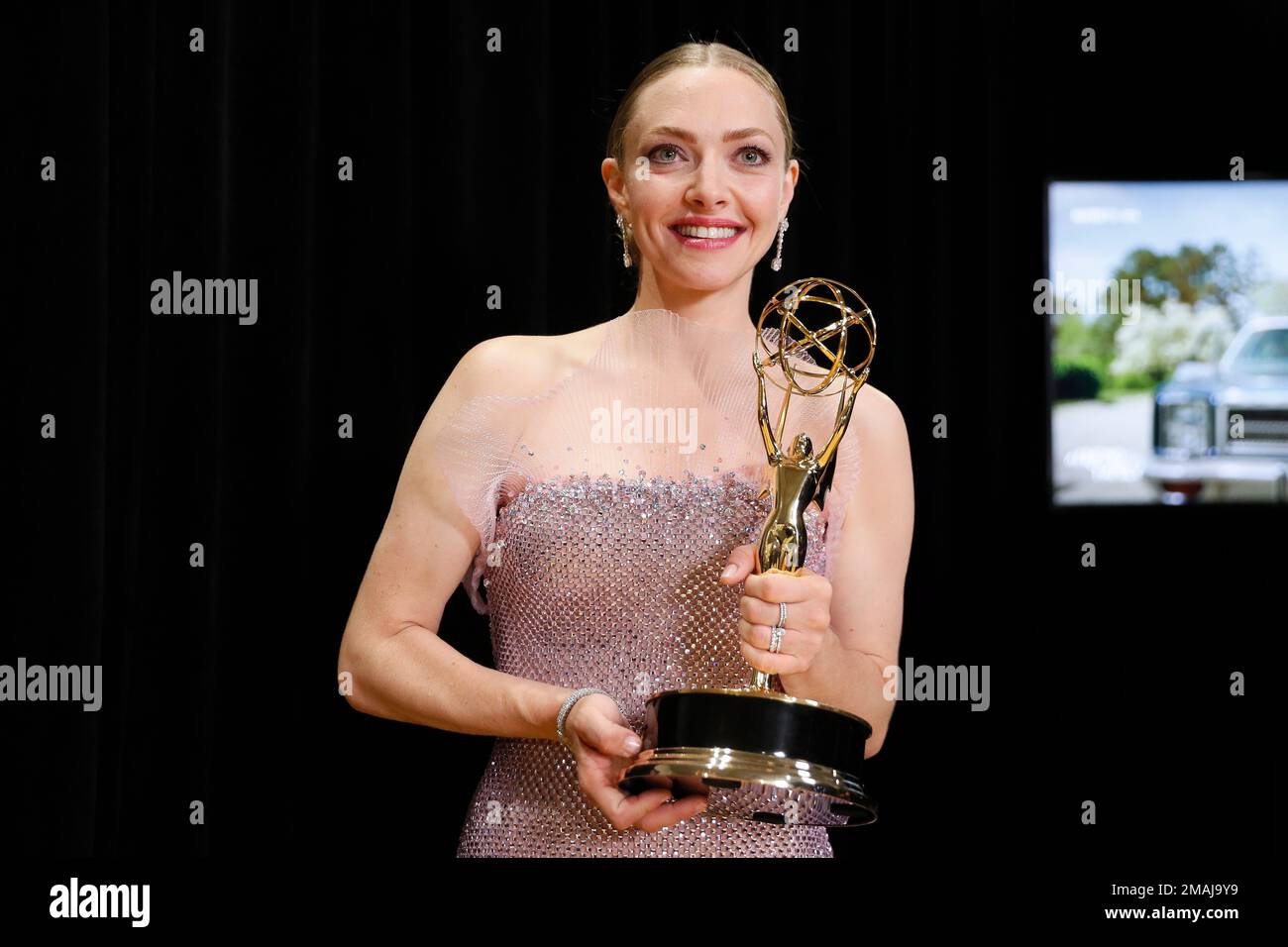 Amanda Seyfried accepts the Emmy for outstanding lead actress in a
