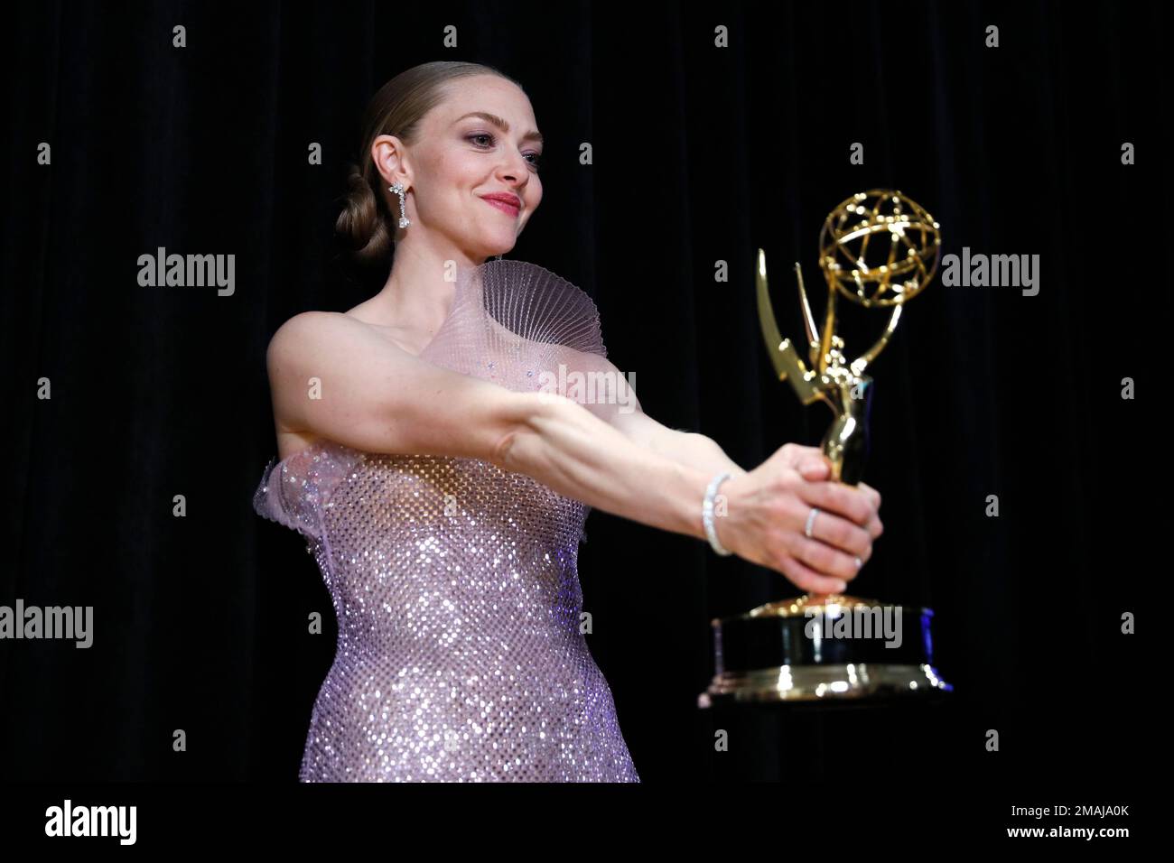 Amanda Seyfried accepts the Emmy for outstanding lead actress in a