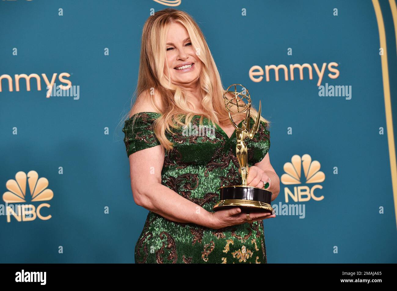 Jennifer Coolidge poses with the Emmy for outstanding supporting