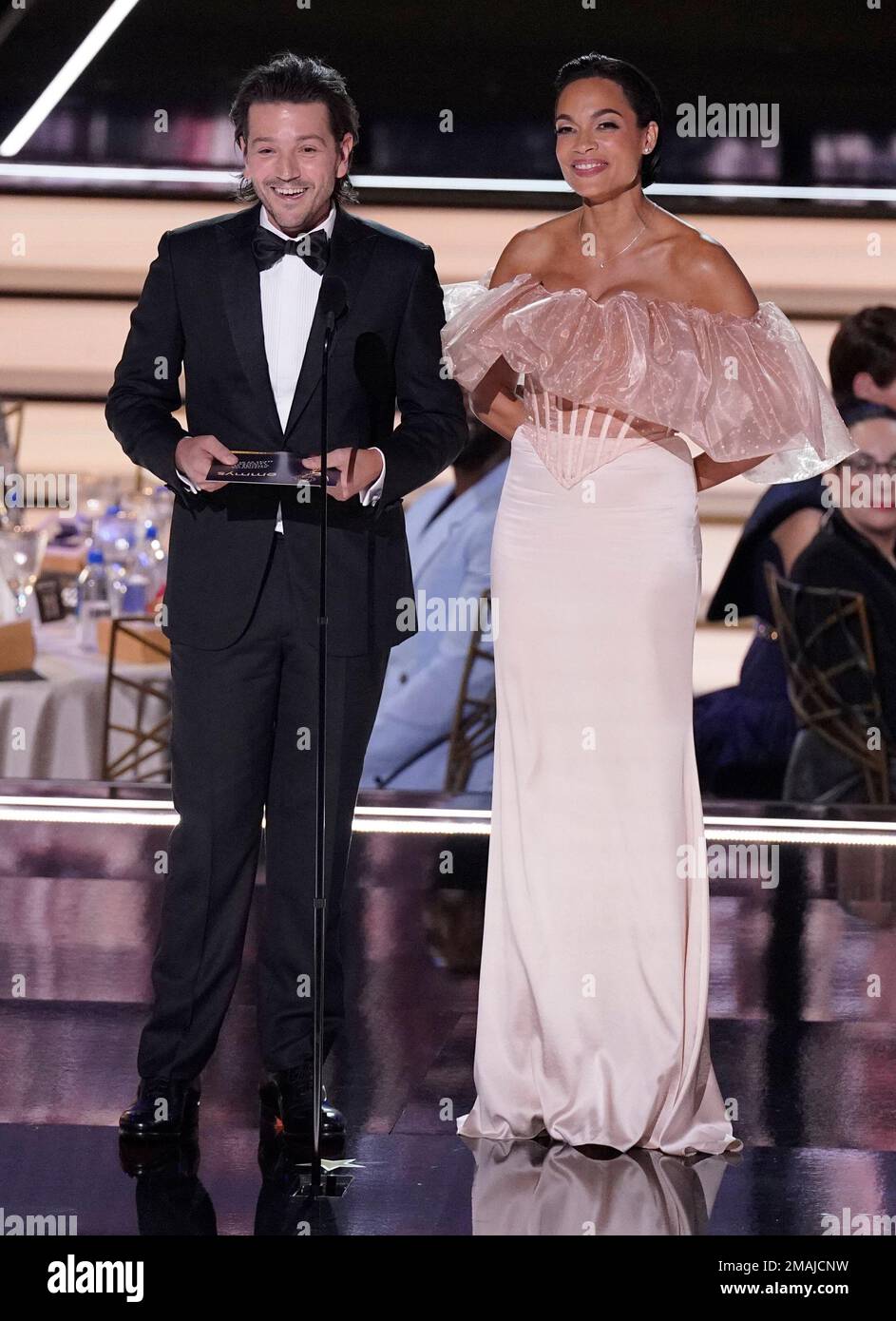 Diego Luna, left, and Rosario Dawson presents the Emmy for